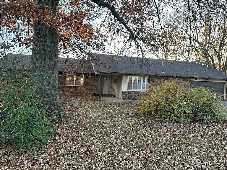 Corner Lot with Home, Workshop, and 1.25 Acres – $172,000