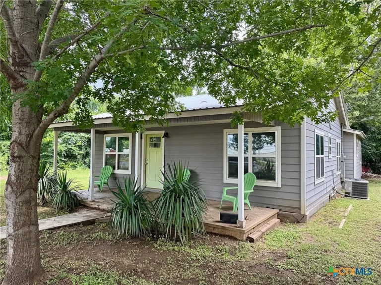 A Rare Texas Creekside Retreat – Timeless Farmhouse Charm, Towering Hardwoods, and Endless Possibilities