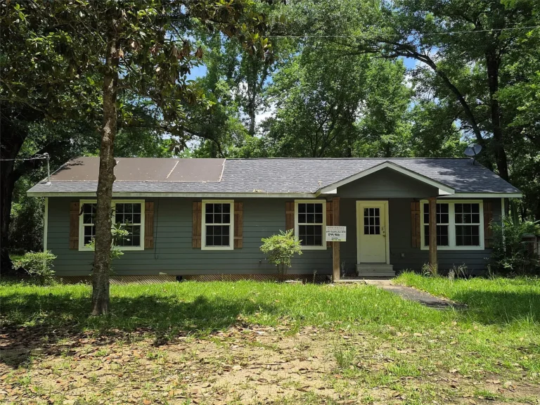 Charming Country Home on 0.725 Acres in Tarkington with Spacious Yard and Outdoor Living Spaces