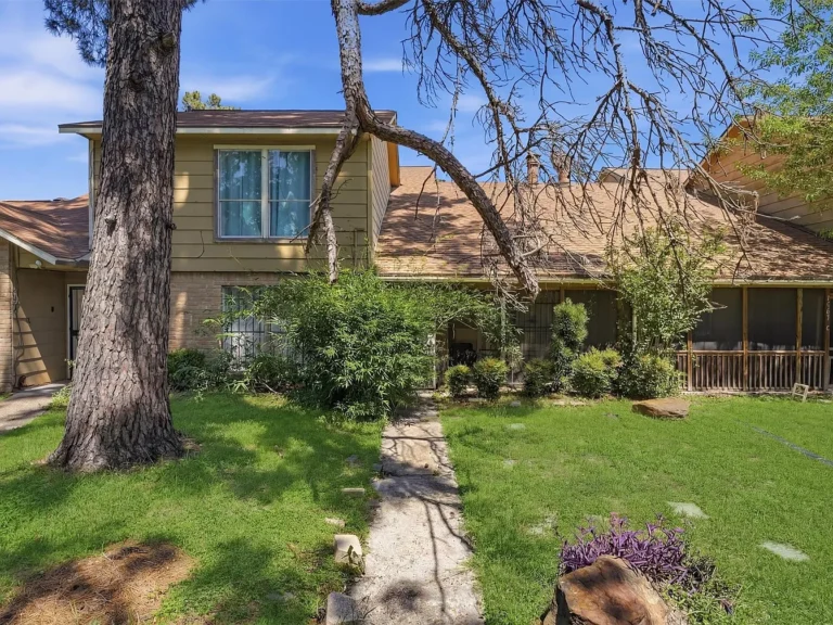 Beautiful Two-Story Townhome in Pine Village North with First-Floor Primary Suite, High Ceilings, Stone Fireplace, and Prime Houston Location